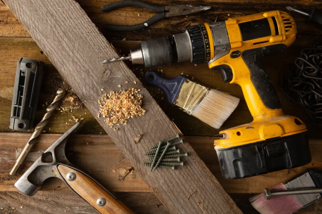 Construction tools on timber symbolizing the miscellaneous pages including privacy policy, careers, newsletter, editorial guidelines and terms and conditions by Deck Builders Taupo.