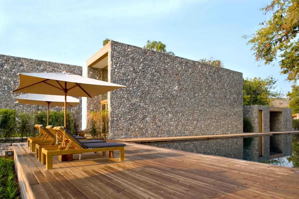 Modern wooden poolside deck showing the building process and quality highlighted in the about us story of Deck Builders Taupo.
