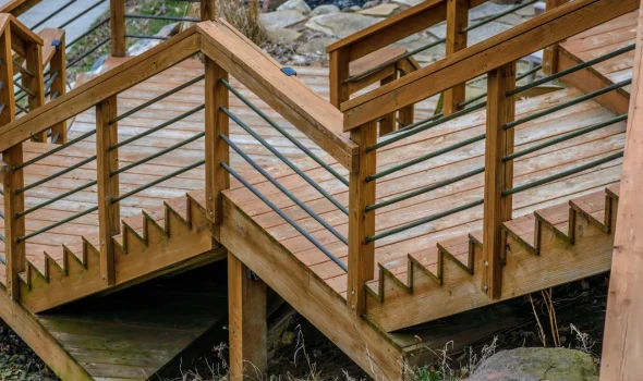 Stylish wooden stairs and railings as part of custom decks designed by Deck Builders Taupo to enhance outdoor living.