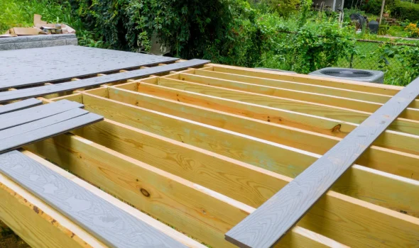 Durable framing and boards being installed for custom decks by Deck Builders Taupo using strong materials.
