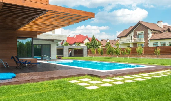 Poolside decks crafted by Deck Builders Taupo, designed with materials that offer strong protection against fading.
